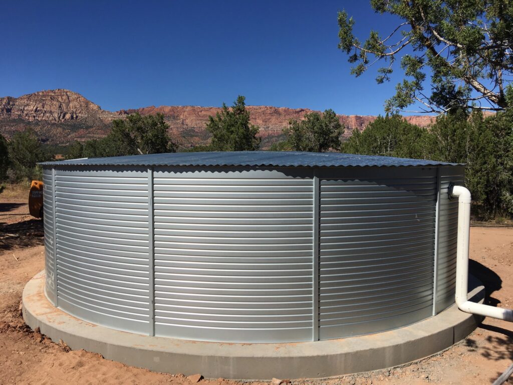 Pioneer XL23 galvanized steel water tank installed on a concrete ring foundation